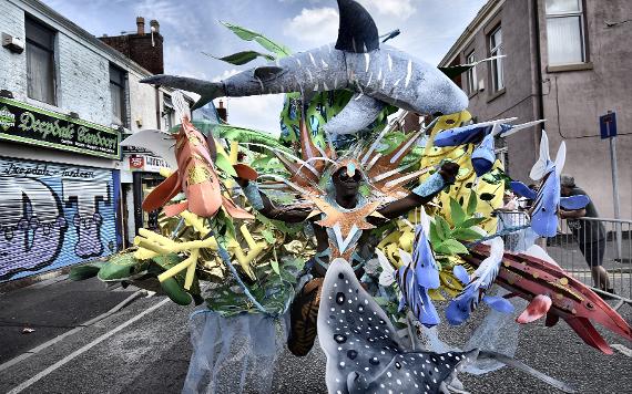 Man in 2018 Caribbean Carnival parade dressed in dramatic sea-themed costume.