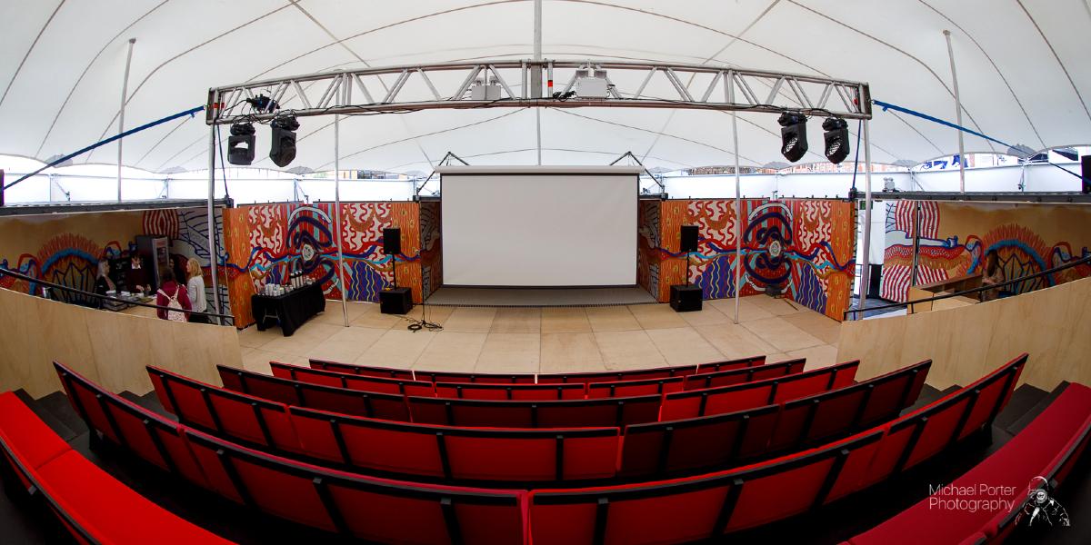 Fish-eye view of The MET venue stage from the seating area.