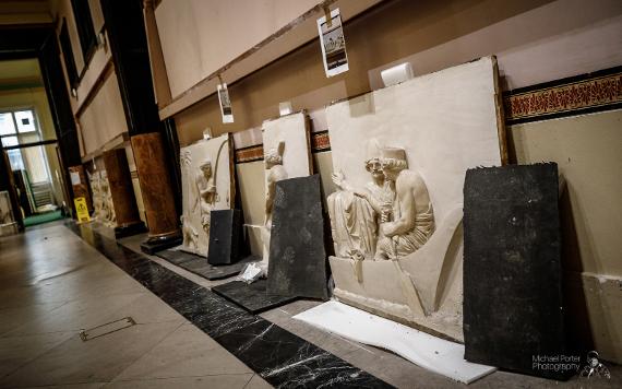 Three Harris wall carvings leant against the downstairs wall, awaiting storage.