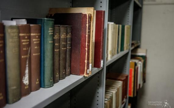 Old books on shelves in storage at The Harris.