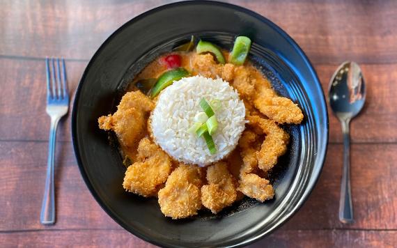 A dish of Crispy Chicken and Prawn with sweet chilli sauce and Rice