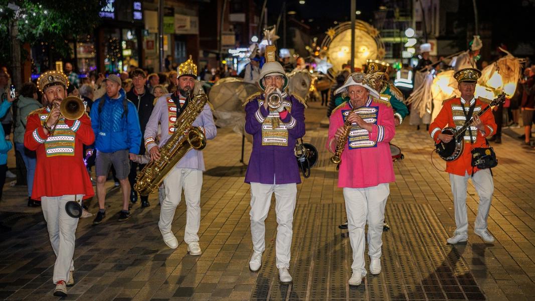 Brass band playing in torchlight procession Brass band playing in torchlight procession