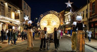 Moon on bicycle in torchlight procession