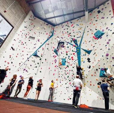 People climbing routes at Preston Wall