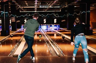 Man and woman bowling