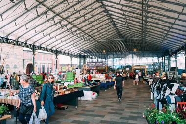 People browsing around the outdoor market