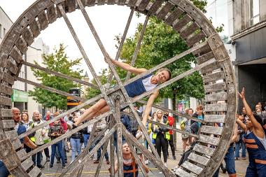 Performer in giant wheel on Fishergate Highstreet