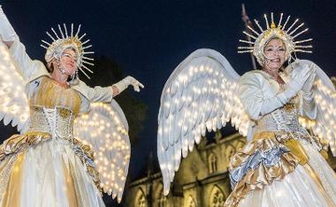 Women dressed as angels in the Torchlight Procession