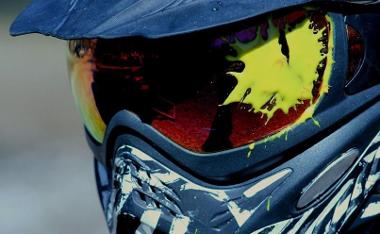 Close up of person with paintball splat on helmet