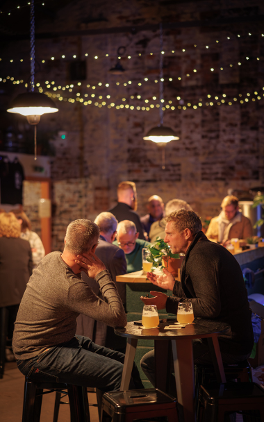 People drinking in outdoor courtyard 