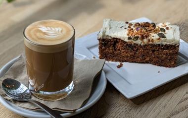 A cortado coffee and a slice of vegan carrot cake from Cedarwood Coffee