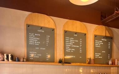 A view of the menu boards behind the serving counter at Rise Coffee House