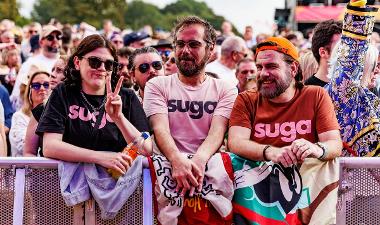 People wearing Suga tshirts in crowd