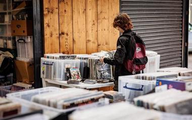 Young person looking at records