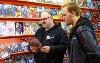 People reading comics at the comic shop