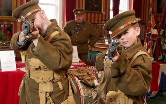 Man and child dressed in military uniforms in the Lancashire Infantry Museum.