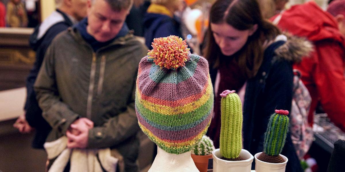 Main image: Hat and knitted cacti on market stall at Harris Etsy makers market. Hat and knitted cacti on market stall at Harris Etsy makers market.