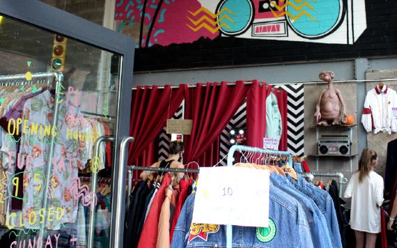 Rails of vintage clothing inside Hollywood Exports, Preston store.