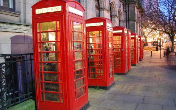 Row of red phone boxes near Preston Flag Market.