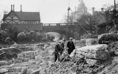 Black and white photo of three men working on creating Avenham Park's Japanese garden,