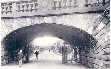 Vintage photograph of man standing by bridge joining Avenham and Miller Park.