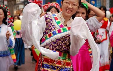 Smiling girl in Preston Guild 2012 community procession.