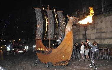 Viking ship spitting out fire during Preston torchlight procession, 2012.