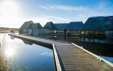 Family walking around Brockholes Visitor Centre.