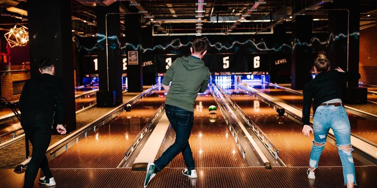 Three friends bowling in Odin's Bowl Preston.