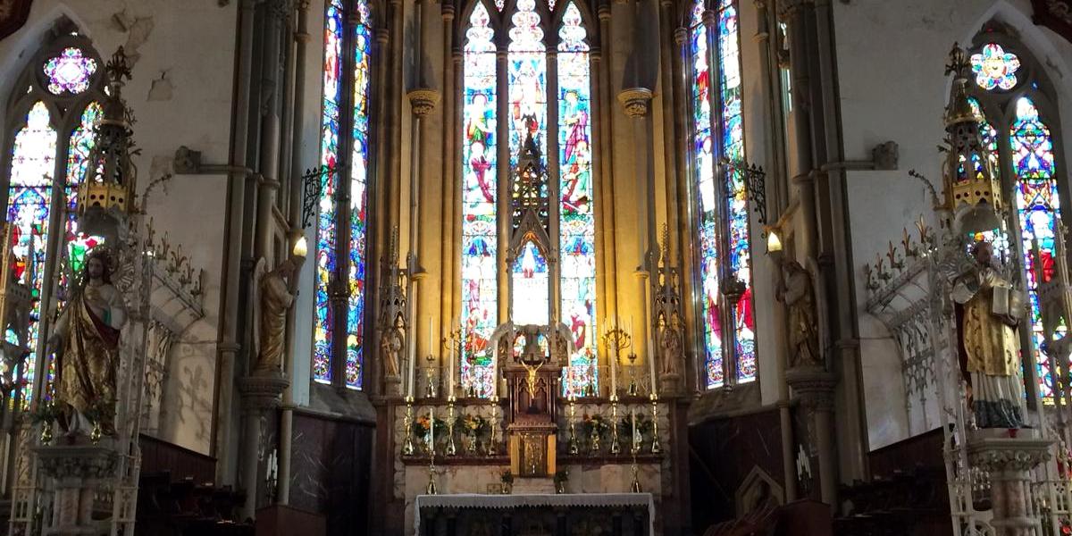 Altar and stained glass windows inside St Walburge's Church.