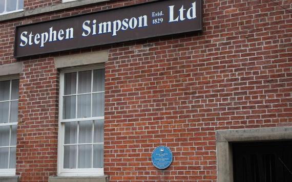 Old Stephen Simpson building with blue plaque.