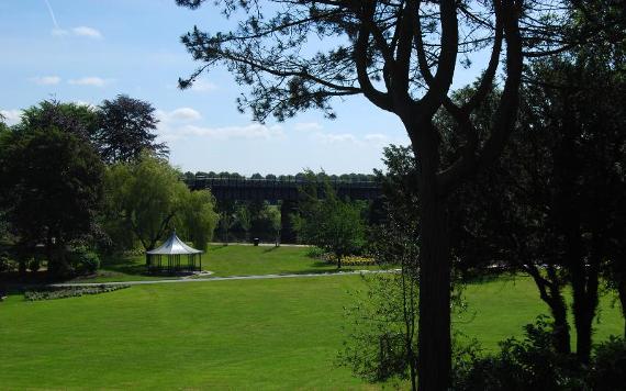 View of gazebo and large green area of Miller Park, Preston.