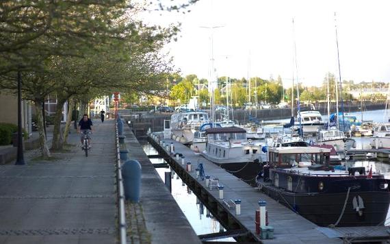 Cyclist along Preston Dock pathway.