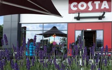 Outside Costa on Queen's Retail Park, Preston, with heather in foreground.