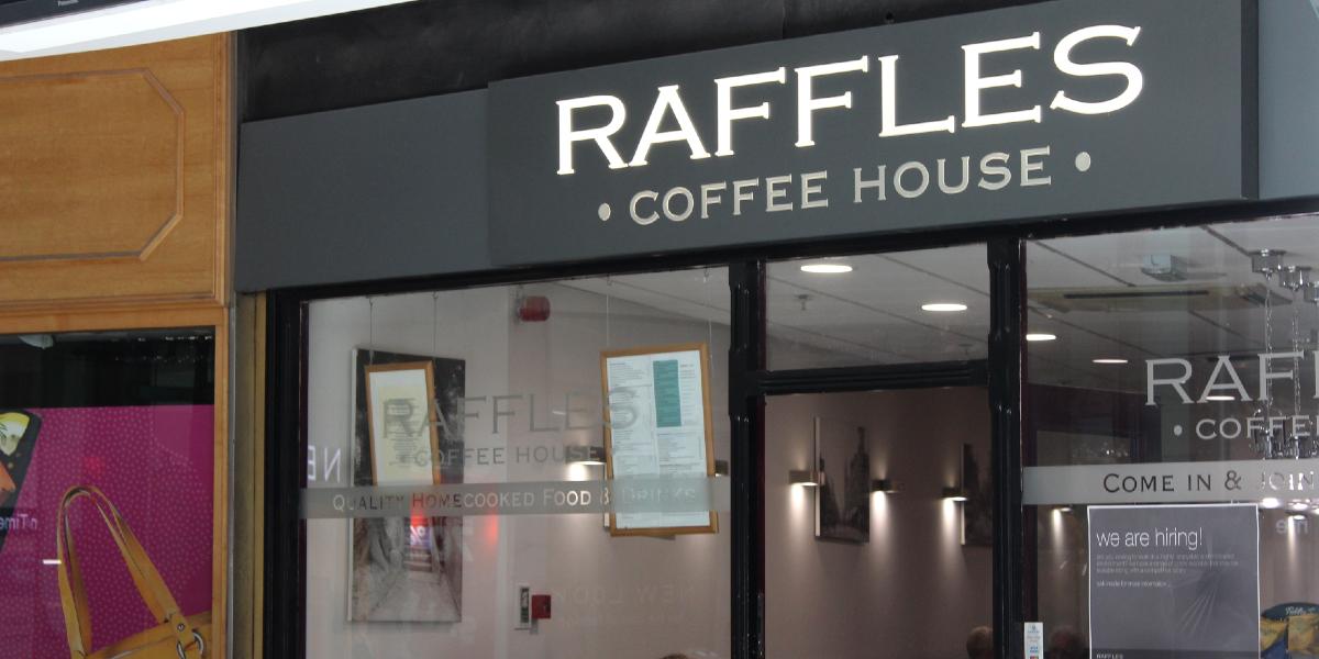 Exterior sign for Raffles Coffee Shop, Preston.