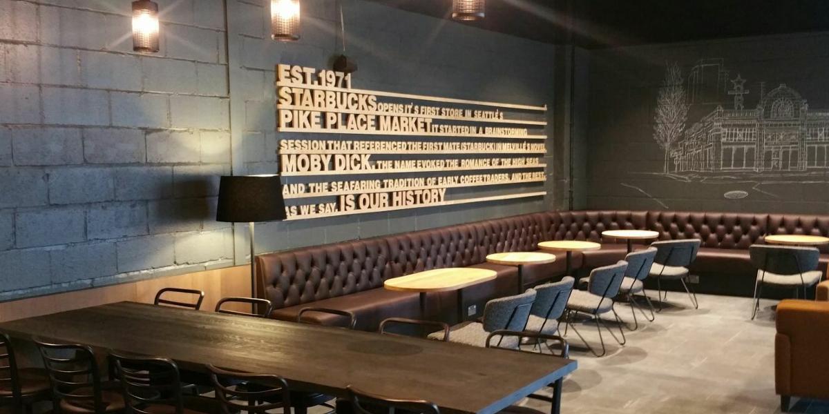 Industrial style seating and decor in Starbucks Fishergate upstairs seating area.