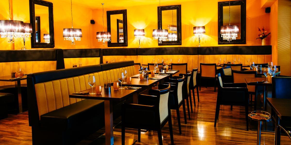 Booths and seating in Theatre Street Bar & Grill's dining area.