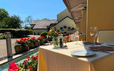 Italian Orchard's outdoor seating and flowers.