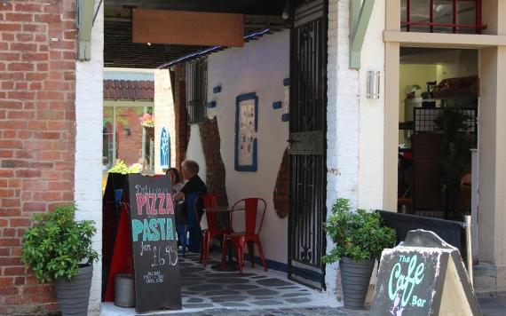 Entrance way into The Cafe Bar courtyard from Winckley Street.