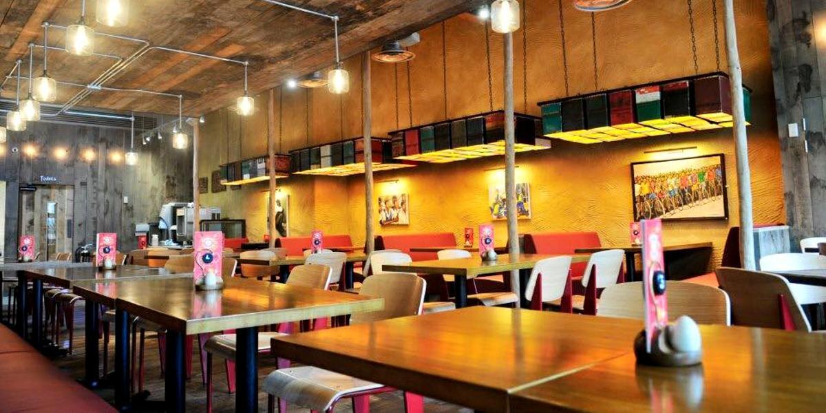 Dining area inside Nando's restaurant on Preston Market Square.