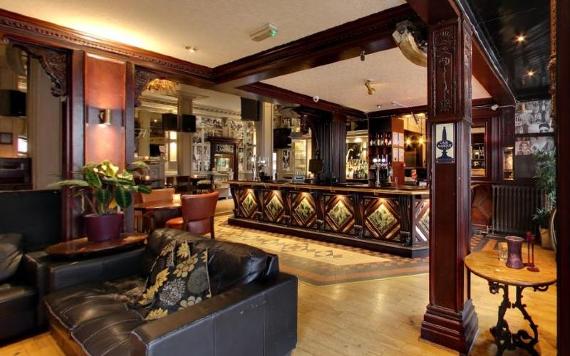 Traditional bar area and seating inside Hartleys Wine Bar.