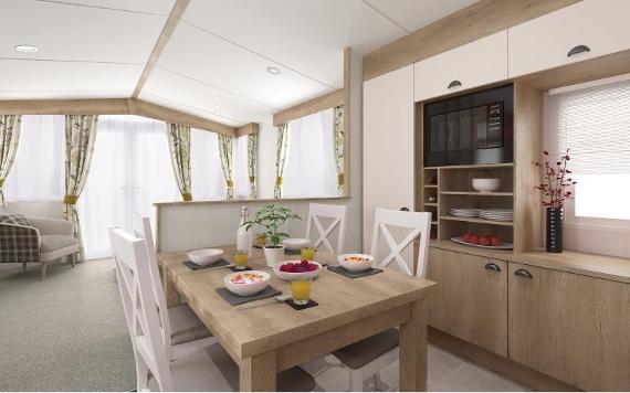 Modern kitchen and dining table in caravan at Mowbreck Caravan Park.