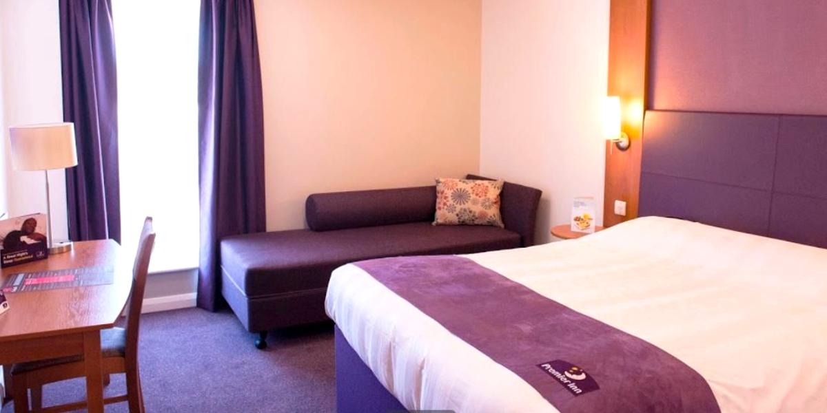 Purple and white hotel room at Preston Central Premier Inn.