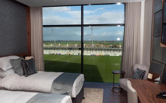 Twin room at Mill Farm with view of football pitch.