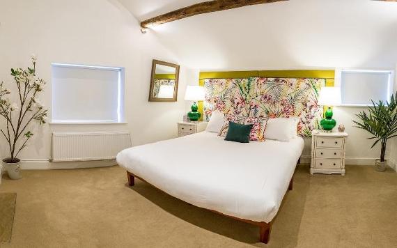 Winckley Stays room decorated with tropical patterns and colours.