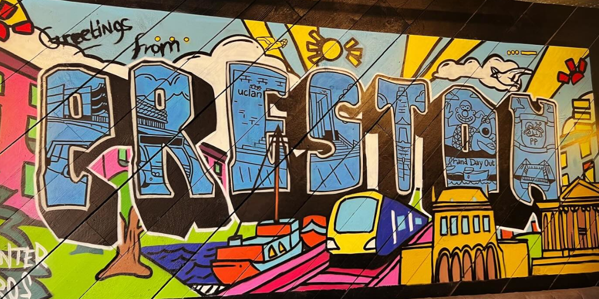 A mural inside All Hopes No Promises that says Greetings from Preston with hand drawn places in Preston.