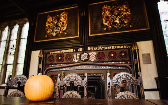 Pumpkin on historic dining table inside Samlesbury Hall.