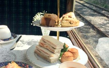 Ribble Steam Railway afternoon tea on table inside train cart.